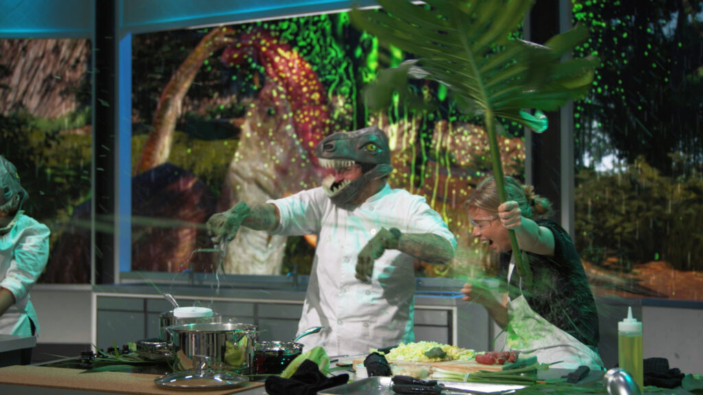 chef cooking in dinosaur costume