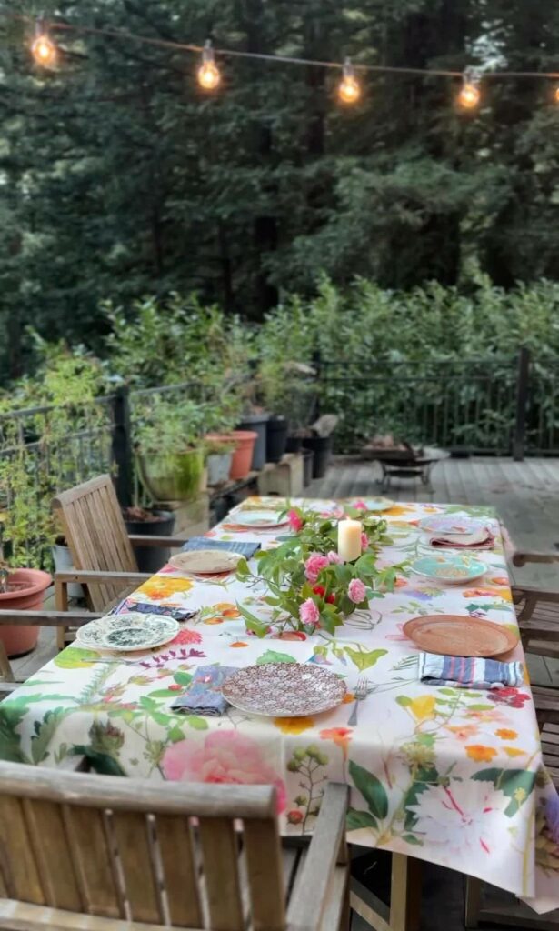 outdoor table setting with watercolor flower tablecloth
